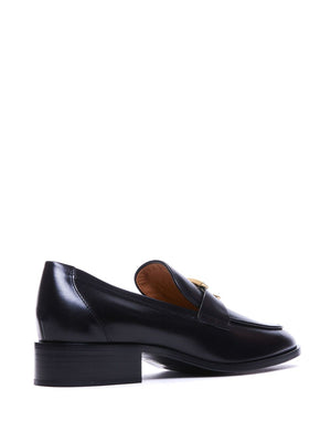 TOD'S Elegant Leather Loafers with Almond Toe and Mid Stacked Heel